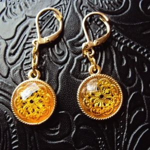 Gold tone dimensional floral dangle earrings